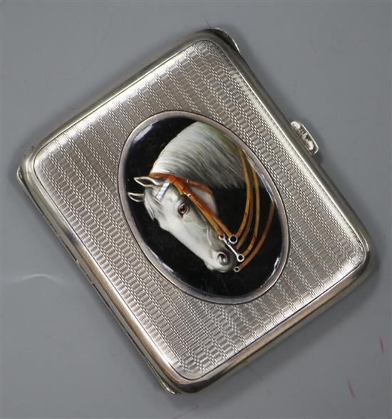 A continental 935 white metal and enamel cigarette case, decorated with the head of a horse, 88mm.